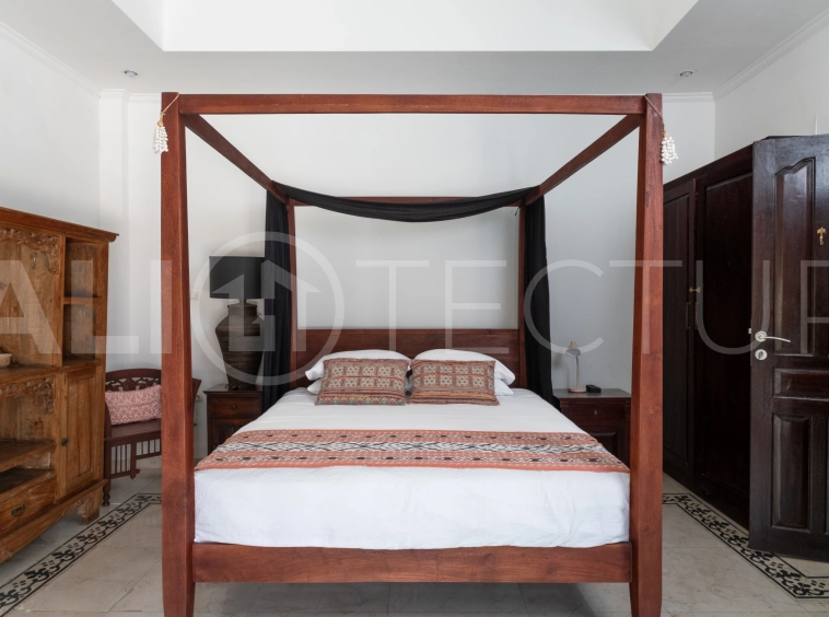 3-bedroom ricefield view villa for sale in Seminyak, featuring a private swimming pool, tropical garden, spacious living areas, and a peaceful residential setting.
