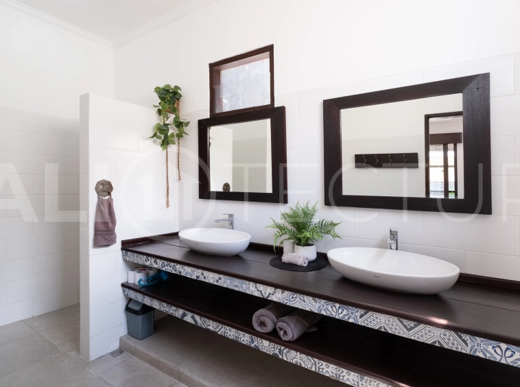 3-bedroom ricefield view villa for sale in Seminyak, featuring a private swimming pool, tropical garden, spacious living areas, and a peaceful residential setting.