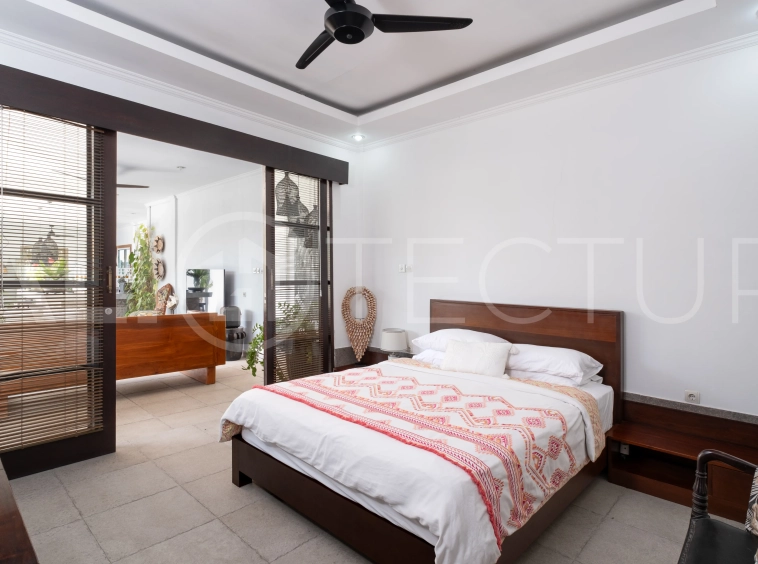 3-bedroom ricefield view villa for sale in Seminyak, featuring a private swimming pool, tropical garden, spacious living areas, and a peaceful residential setting.