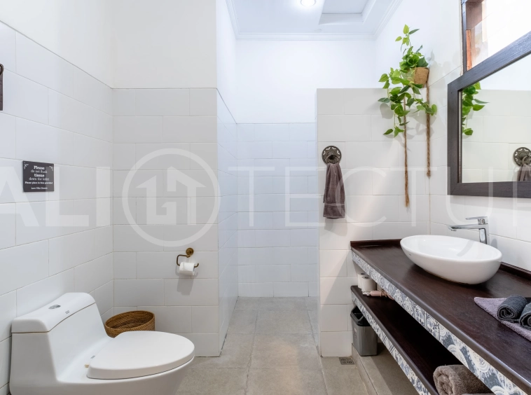 3-bedroom ricefield view villa for sale in Seminyak, featuring a private swimming pool, tropical garden, spacious living areas, and a peaceful residential setting.