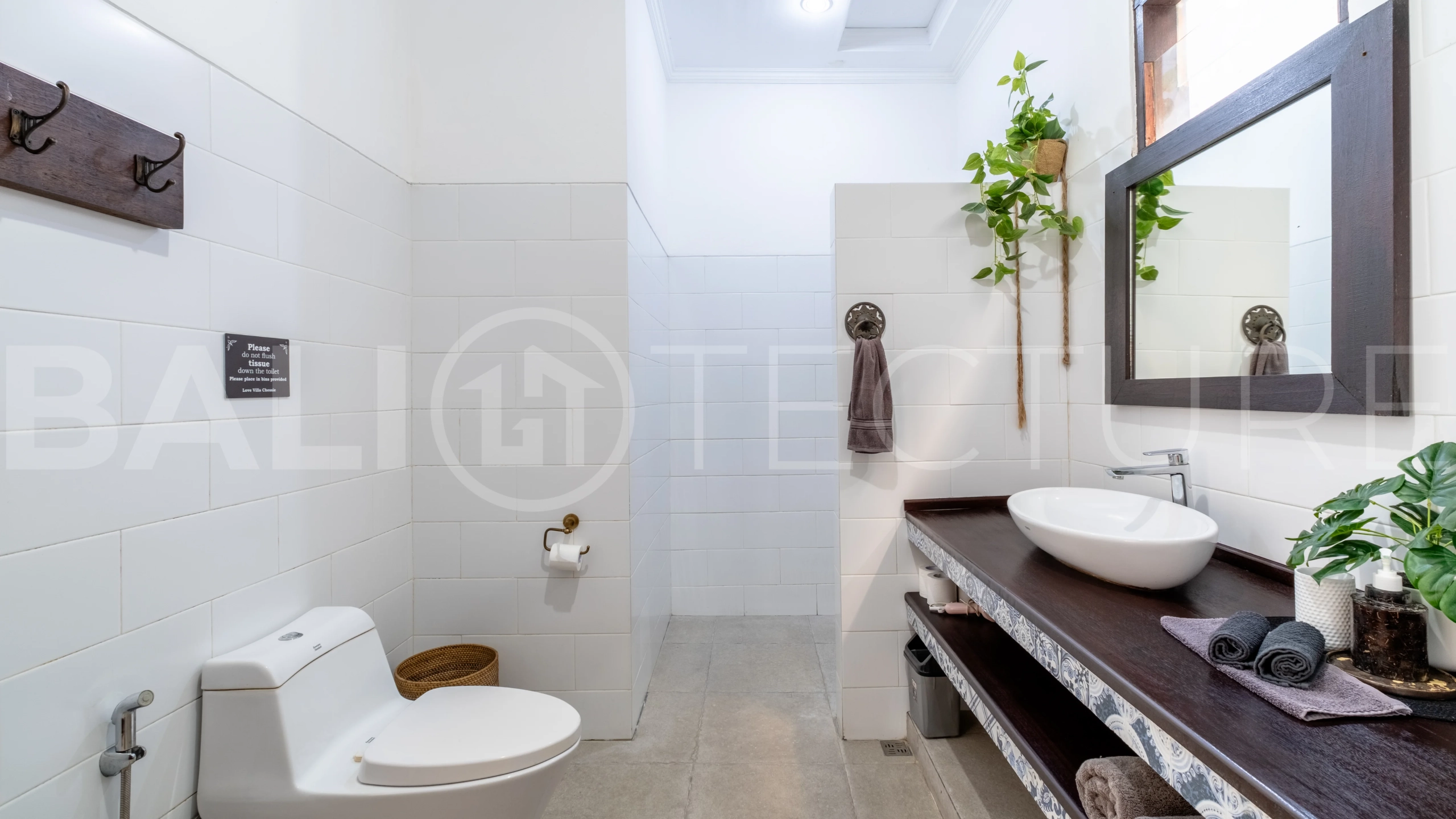 3-bedroom ricefield view villa for sale in Seminyak, featuring a private swimming pool, tropical garden, spacious living areas, and a peaceful residential setting.