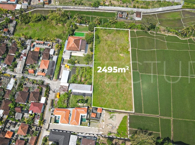 2,495 m² yellow-zone leasehold land for sale in Nyambu, Kaba Kaba, with rectangular shape, car and motorbike access, and scenic rice field and mountain views.