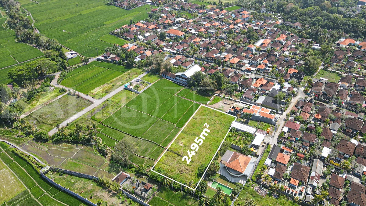 2,495 m² yellow-zone leasehold land for sale in Nyambu, Kaba Kaba, with rectangular shape, car and motorbike access, and scenic rice field and mountain views.