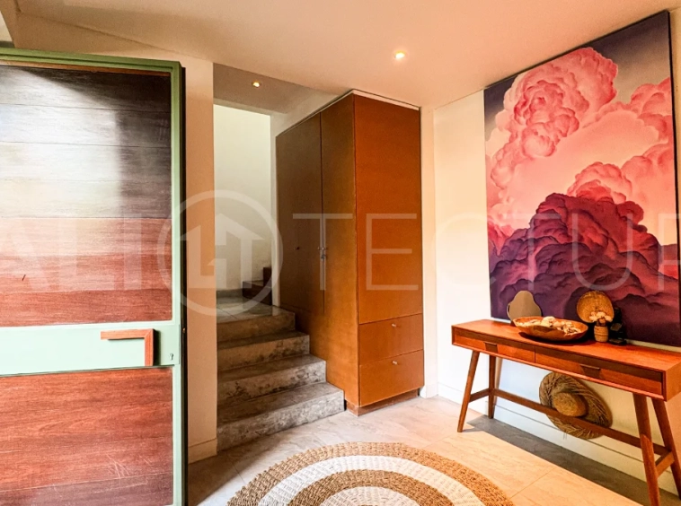 Modern four-bedroom villa in Tumbak Bayuh, Pererenan, featuring a private 12-meter swimming pool, tropical garden, double-height living area, spacious outdoor terrace, and contemporary furnished interiors on a 5.5-are plot.