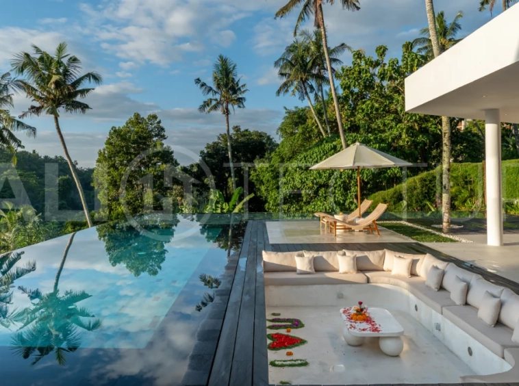 Brand-new 4-bedroom luxury leasehold villa for sale in tranquil Ubud, featuring a 100 sqm infinity pool overlooking lush canyon views, tropical modern architecture, spacious open-plan living areas, private parking, and unobstructed sunrise views.