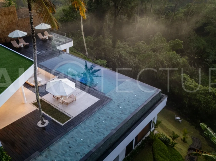 Brand-new 4-bedroom luxury leasehold villa for sale in tranquil Ubud, featuring a 100 sqm infinity pool overlooking lush canyon views, tropical modern architecture, spacious open-plan living areas, private parking, and unobstructed sunrise views.