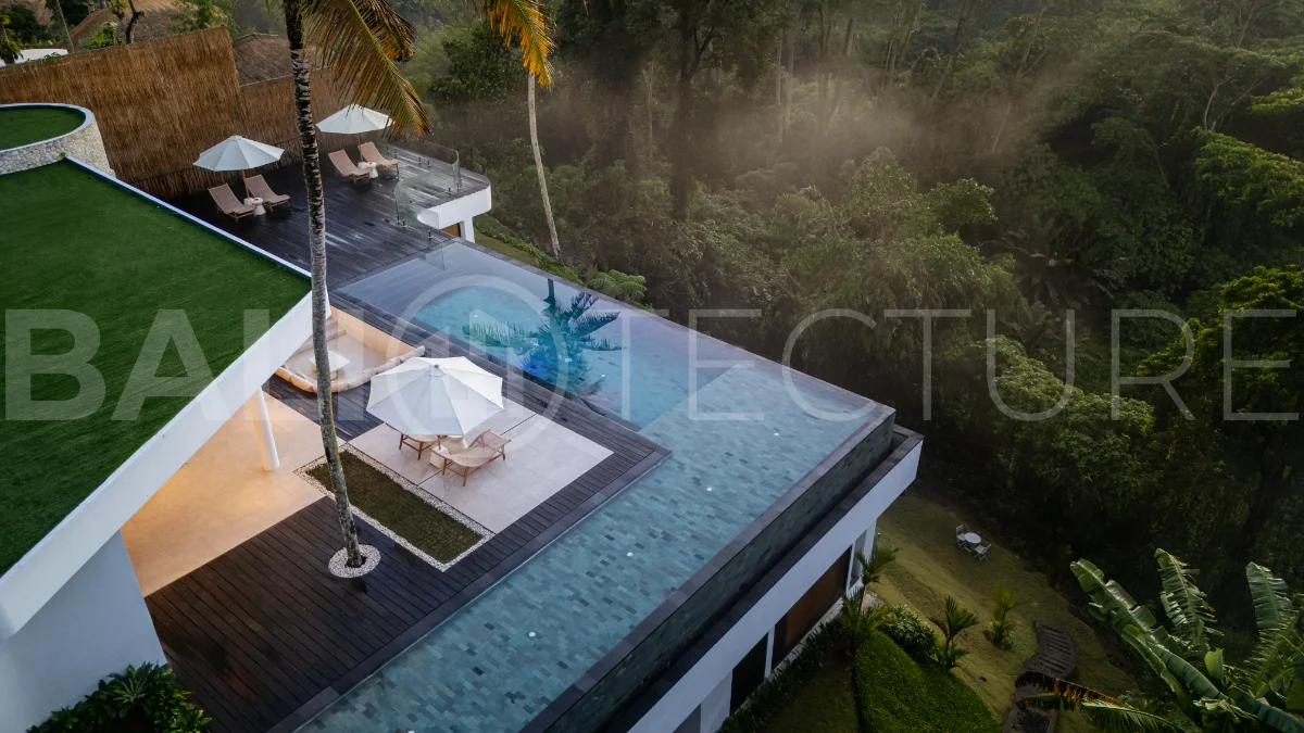 Brand-new 4-bedroom luxury leasehold villa for sale in tranquil Ubud, featuring a 100 sqm infinity pool overlooking lush canyon views, tropical modern architecture, spacious open-plan living areas, private parking, and unobstructed sunrise views.