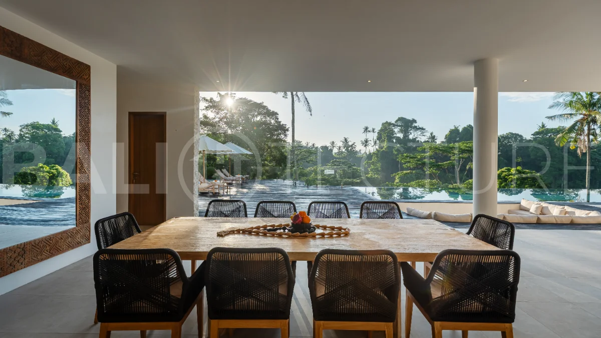 Brand-new 4-bedroom luxury leasehold villa for sale in tranquil Ubud, featuring a 100 sqm infinity pool overlooking lush canyon views, tropical modern architecture, spacious open-plan living areas, private parking, and unobstructed sunrise views.