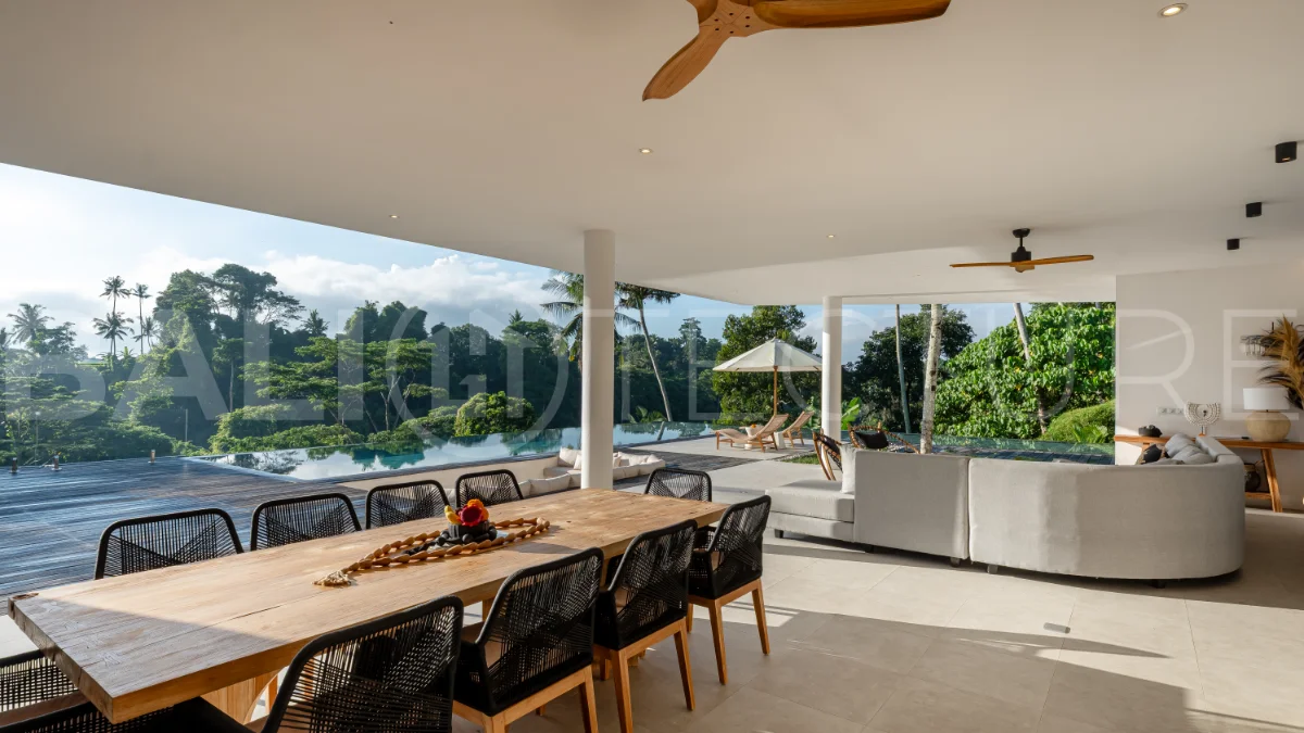 Brand-new 4-bedroom luxury leasehold villa for sale in tranquil Ubud, featuring a 100 sqm infinity pool overlooking lush canyon views, tropical modern architecture, spacious open-plan living areas, private parking, and unobstructed sunrise views.