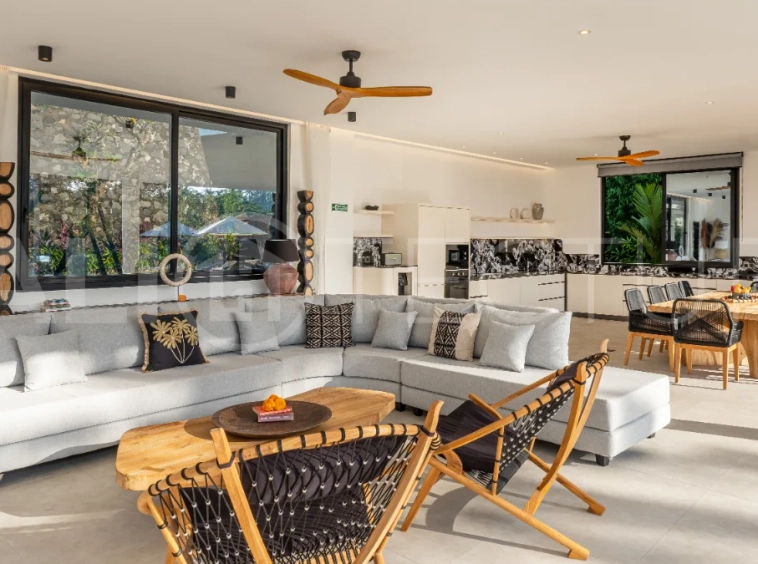 Brand-new 4-bedroom luxury leasehold villa for sale in tranquil Ubud, featuring a 100 sqm infinity pool overlooking lush canyon views, tropical modern architecture, spacious open-plan living areas, private parking, and unobstructed sunrise views.