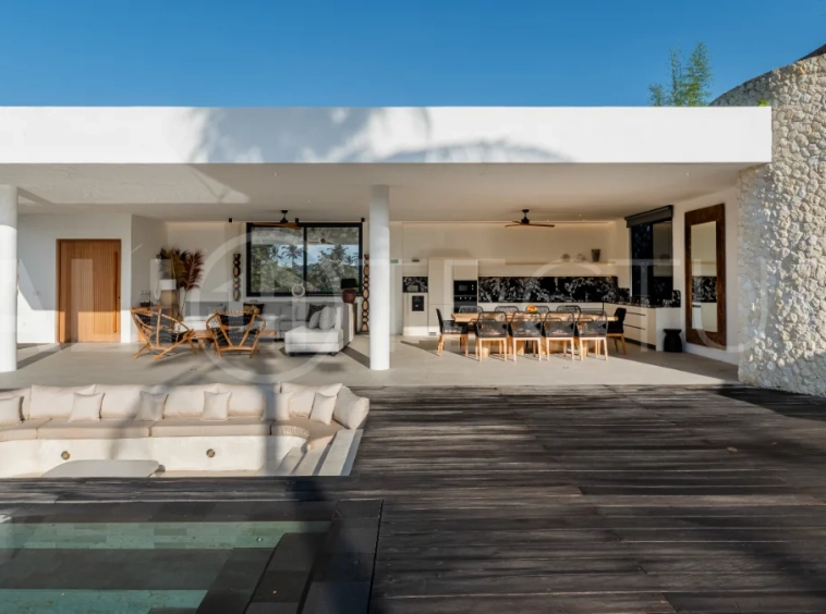Brand-new 4-bedroom luxury leasehold villa for sale in tranquil Ubud, featuring a 100 sqm infinity pool overlooking lush canyon views, tropical modern architecture, spacious open-plan living areas, private parking, and unobstructed sunrise views.