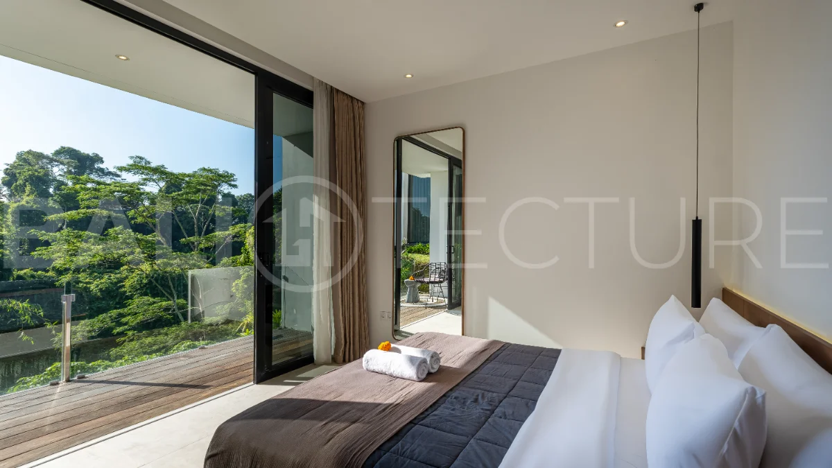 Brand-new 4-bedroom luxury leasehold villa for sale in tranquil Ubud, featuring a 100 sqm infinity pool overlooking lush canyon views, tropical modern architecture, spacious open-plan living areas, private parking, and unobstructed sunrise views.