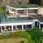 Brand-new 4-bedroom luxury leasehold villa for sale in tranquil Ubud, featuring a 100 sqm infinity pool overlooking lush canyon views, tropical modern architecture, spacious open-plan living areas, private parking, and unobstructed sunrise views.