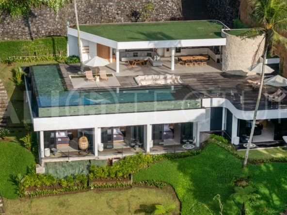 Brand-new 4-bedroom luxury leasehold villa for sale in tranquil Ubud, featuring a 100 sqm infinity pool overlooking lush canyon views, tropical modern architecture, spacious open-plan living areas, private parking, and unobstructed sunrise views.