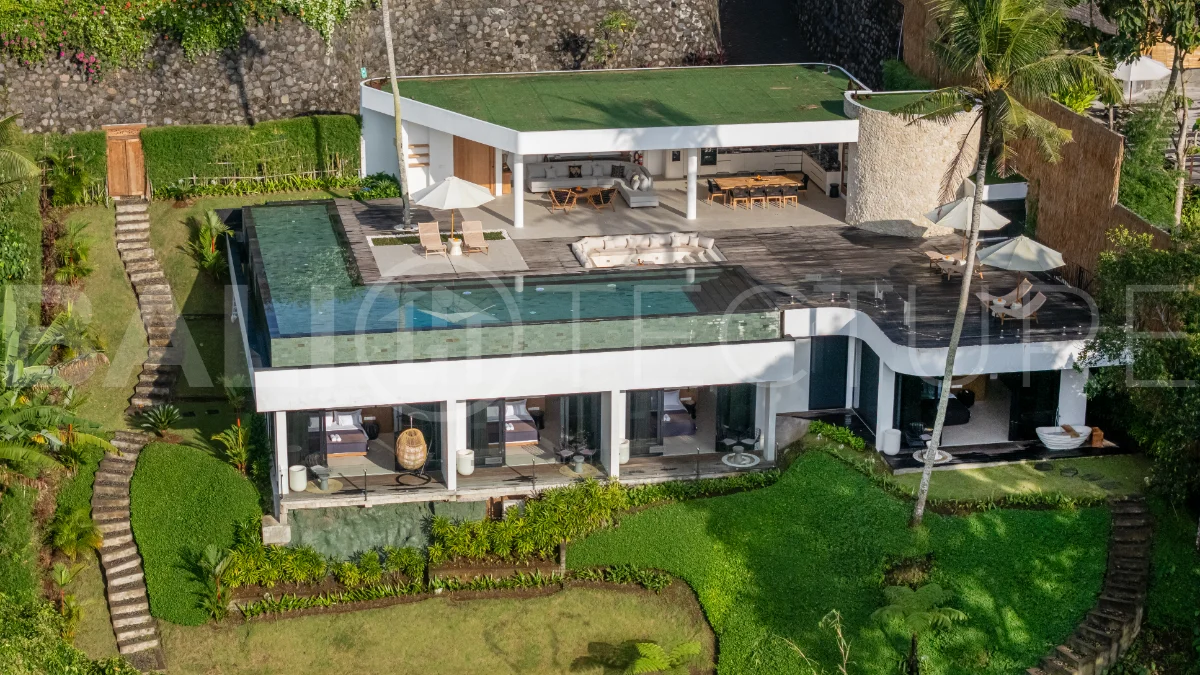 Brand-new 4-bedroom luxury leasehold villa for sale in tranquil Ubud, featuring a 100 sqm infinity pool overlooking lush canyon views, tropical modern architecture, spacious open-plan living areas, private parking, and unobstructed sunrise views.