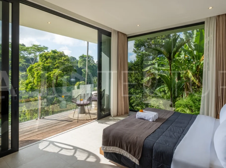 Brand-new 4-bedroom luxury leasehold villa for sale in tranquil Ubud, featuring a 100 sqm infinity pool overlooking lush canyon views, tropical modern architecture, spacious open-plan living areas, private parking, and unobstructed sunrise views.