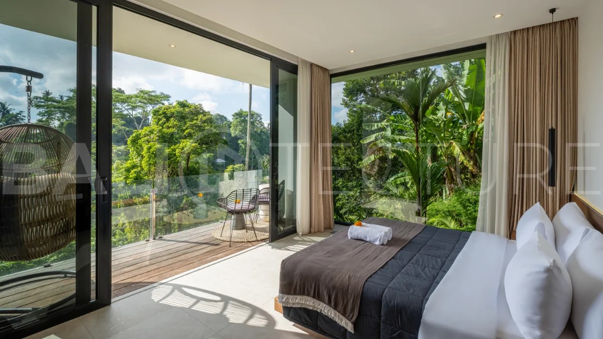 Brand-new 4-bedroom luxury leasehold villa for sale in tranquil Ubud, featuring a 100 sqm infinity pool overlooking lush canyon views, tropical modern architecture, spacious open-plan living areas, private parking, and unobstructed sunrise views.
