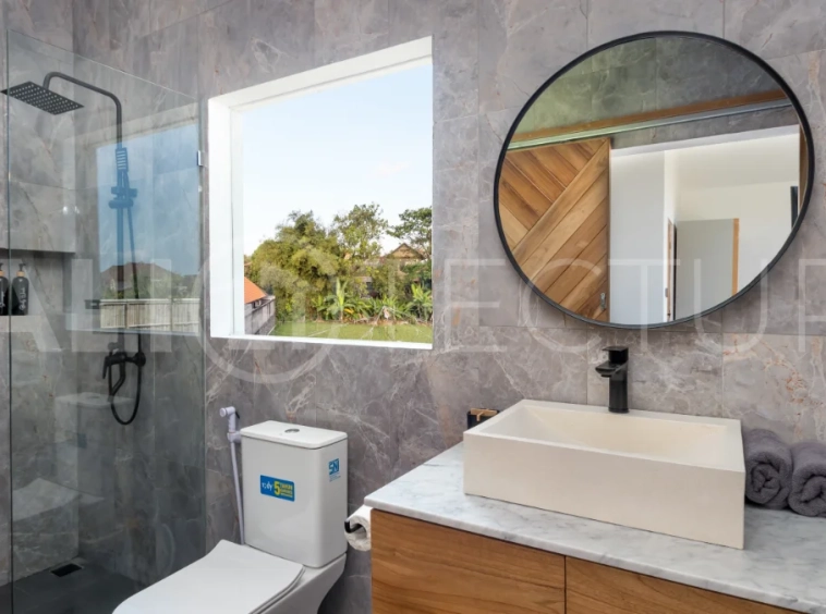 Umalas Bali villa enclave featuring four modern two-bedroom villas with private pools, tropical surroundings, and off-street parking.