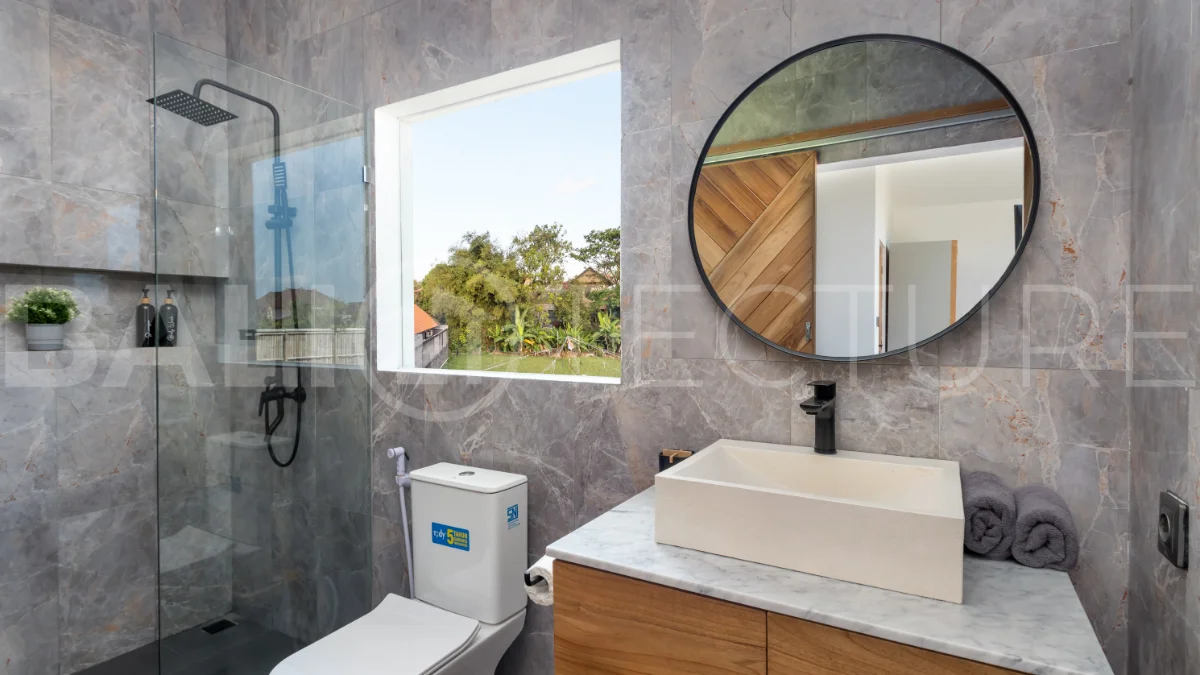 Umalas Bali villa enclave featuring four modern two-bedroom villas with private pools, tropical surroundings, and off-street parking.