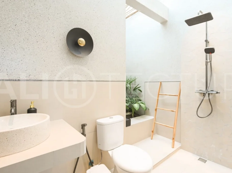 Brand-new 2-bedroom villa for sale in Pecatu, Uluwatu, featuring a modern two-storey design, 55 m² of land, 70 m² of building space, and a private jacuzzi, close to beaches, restaurants, cafés, gyms, golf, and renowned beach clubs.