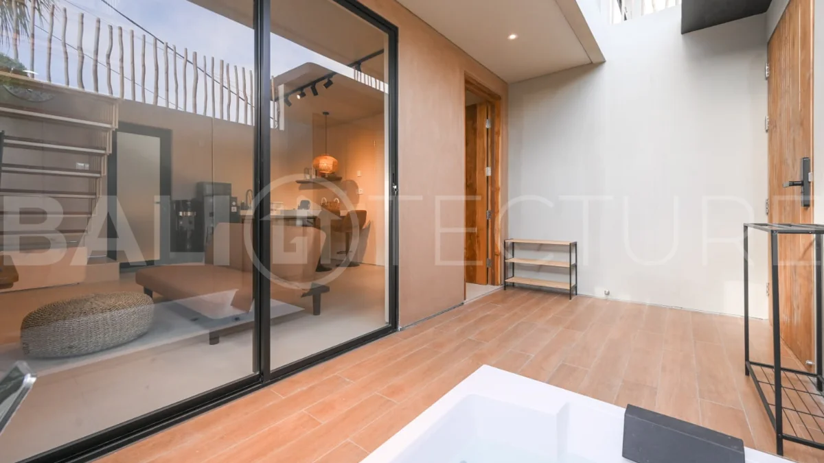 Brand-new 2-bedroom villa for sale in Pecatu, Uluwatu, featuring a modern two-storey design, 55 m² of land, 70 m² of building space, and a private jacuzzi, close to beaches, restaurants, cafés, gyms, golf, and renowned beach clubs.