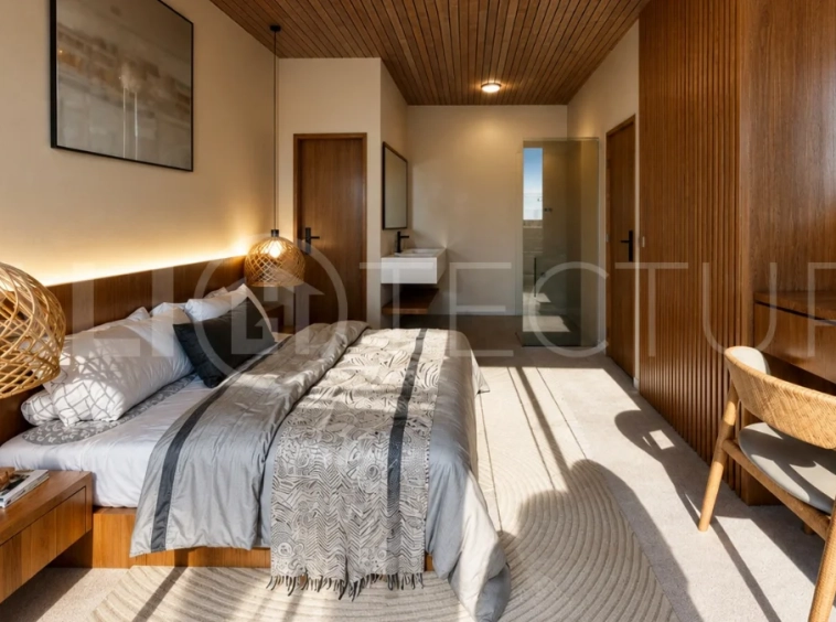 Modern tropical 2-bedroom villa development for sale in Cepaka, Kaba Kaba, Bali, featuring lush tropical landscaping, natural stone and wood finishes, private villa options, and a shared infinity pool.