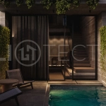 Modern one bedroom villa near Pererenan Beach in Bali, featuring a private pool, tropical landscaping, natural stone and teak wood finishes, panoramic glazing, and a stylish resort inspired interior.