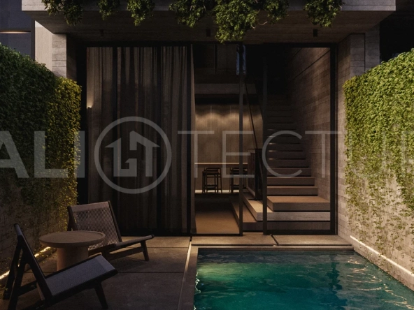 Modern one bedroom villa near Pererenan Beach in Bali, featuring a private pool, tropical landscaping, natural stone and teak wood finishes, panoramic glazing, and a stylish resort inspired interior.