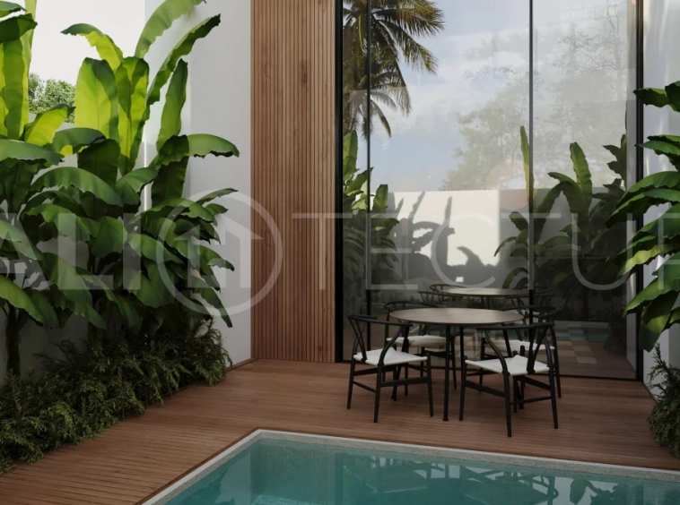 Off-plan one-bedroom loft villa near Melasti Beach, Bali, featuring a double-height living area, private plunge pool, tropical landscaping, fully furnished interiors, and ocean views from selected back-row units. Set within an exclusive 12-villa development on the Bukit with 25-year leasehold ownership in a Pink Zone.