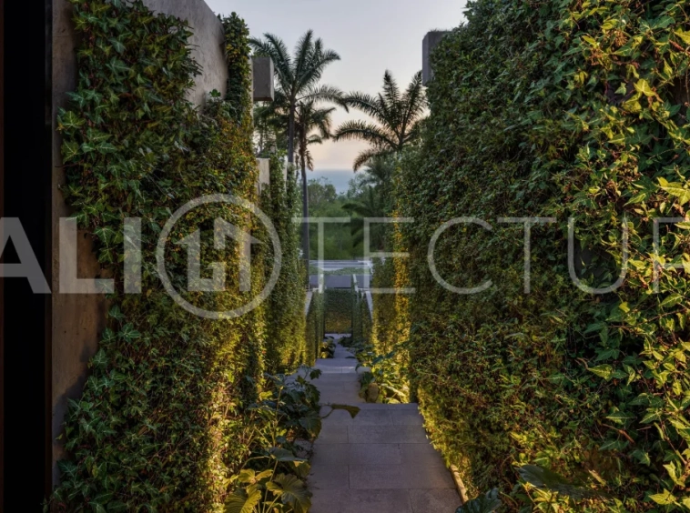 Modern tropical two bedroom villa near Savaya Uluwatu, surrounded by lush jungle greenery and featuring a private pool, landscaped outdoor spaces, contemporary architecture, and a tranquil tropical setting.