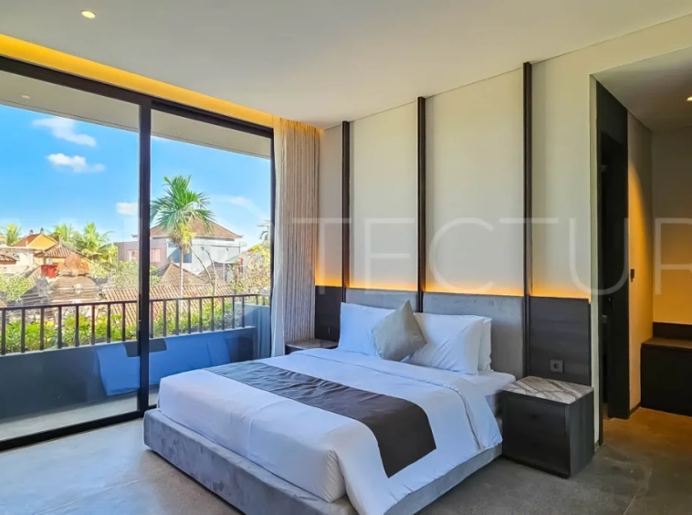 Modern two-storey luxury villa in Ubud featuring a private swimming pool, lush tropical landscaping, floor-to-ceiling glass doors, and a stylish contemporary exterior.