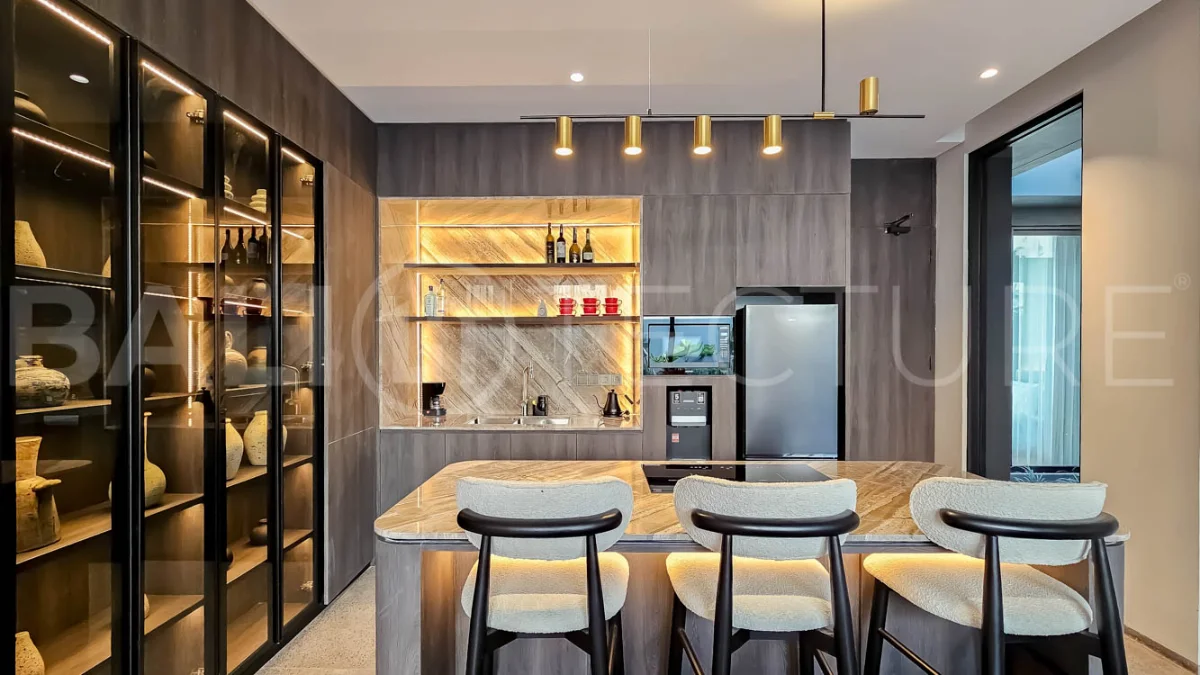 Modern two-storey luxury villa in Ubud featuring a private swimming pool, lush tropical landscaping, floor-to-ceiling glass doors, and a stylish contemporary exterior.