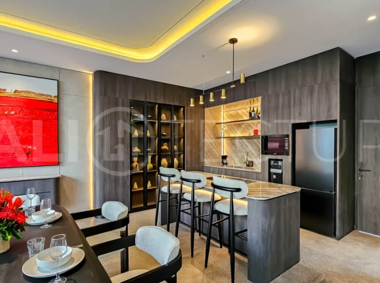 Modern two-storey luxury villa in Ubud featuring a private swimming pool, lush tropical landscaping, floor-to-ceiling glass doors, and a stylish contemporary exterior.