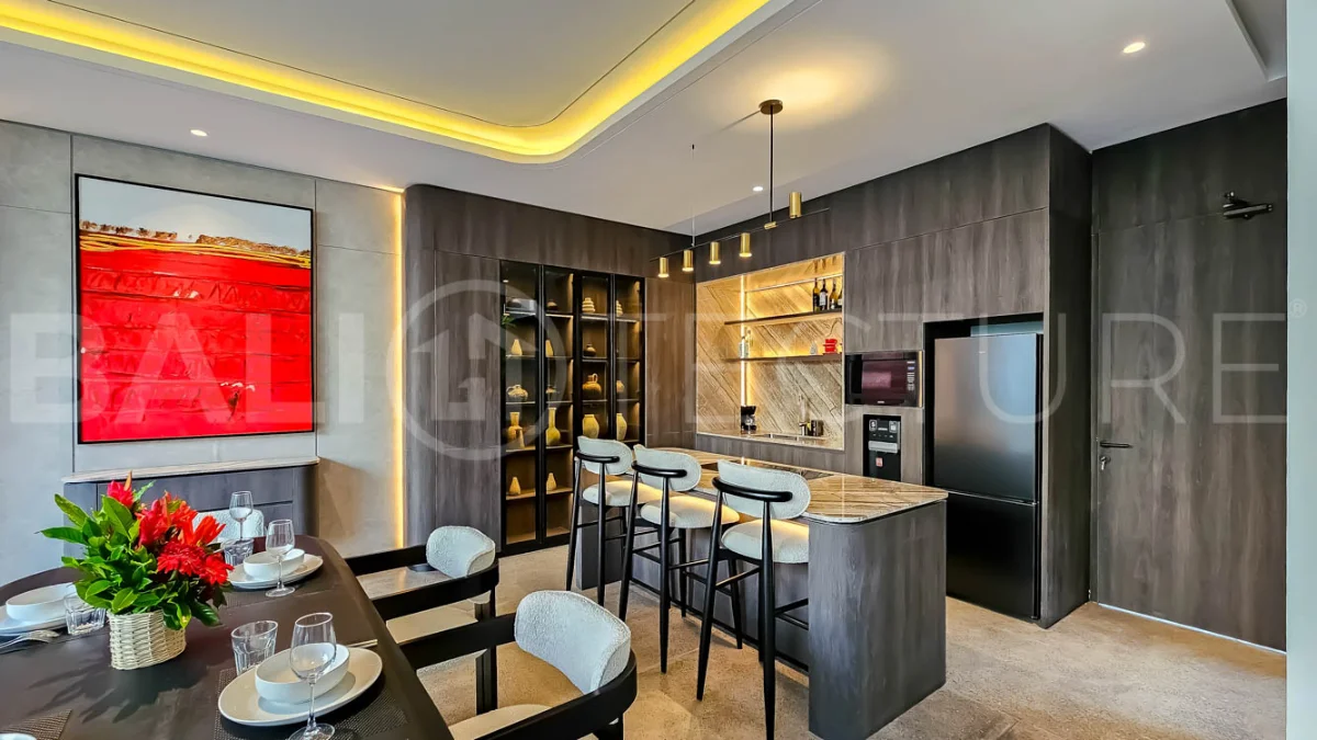 Modern two-storey luxury villa in Ubud featuring a private swimming pool, lush tropical landscaping, floor-to-ceiling glass doors, and a stylish contemporary exterior.