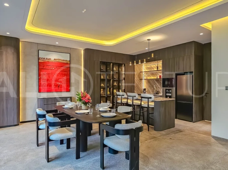 Modern two-storey luxury villa in Ubud featuring a private swimming pool, lush tropical landscaping, floor-to-ceiling glass doors, and a stylish contemporary exterior.
