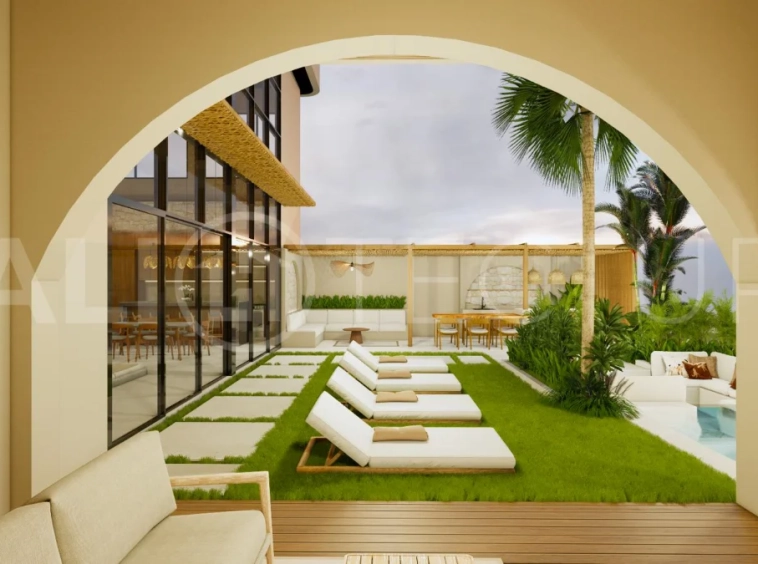 Modern tropical 4-bedroom villa for sale in Cepaka, Kaba Kaba, Bali, featuring natural stone and wood finishes, lush tropical surroundings, landscaped terraces, and a private swimming pool.
