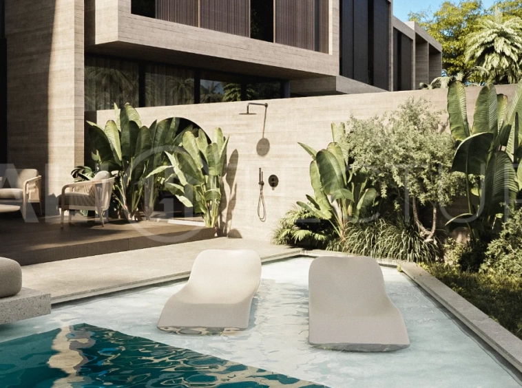 Spacious modern four bedroom villa near Pererenan Beach in Bali, featuring a private swimming pool, tropical landscaping, natural travertine and teak finishes, expansive glazing, elegant interiors, and a landscaped private courtyard.