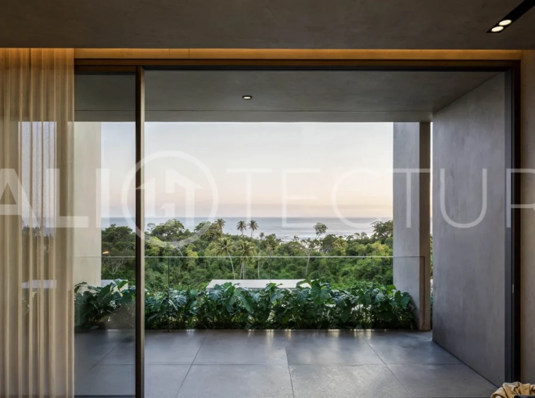 Luxury ocean view villa near Savaya Uluwatu, surrounded by jungle, featuring modern architecture, a private pool, spacious outdoor areas, and panoramic views of the ocean and tropical landscape.