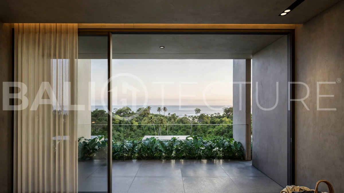 Luxury ocean view villa near Savaya Uluwatu, surrounded by jungle, featuring modern architecture, a private pool, spacious outdoor areas, and panoramic views of the ocean and tropical landscape.