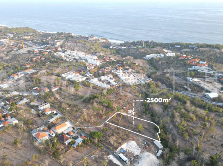 2,500 m² touristic zoning land for lease in Melasti, South Bali, with lush jungle surroundings, sloping terrain, 4-meter access road, and development potential near Melasti Beach.