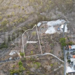2,500 m² touristic zoning land for lease in Melasti, South Bali, with lush jungle surroundings, sloping terrain, 4-meter access road, and development potential near Melasti Beach.