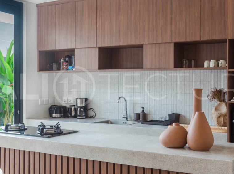 Four-bedroom furnished villa in Padonan, Canggu, featuring three bathrooms, a guest powder room, a private swimming pool, a spacious terrace, a balcony, and flexible indoor-outdoor living spaces, available on a 26-year leasehold.