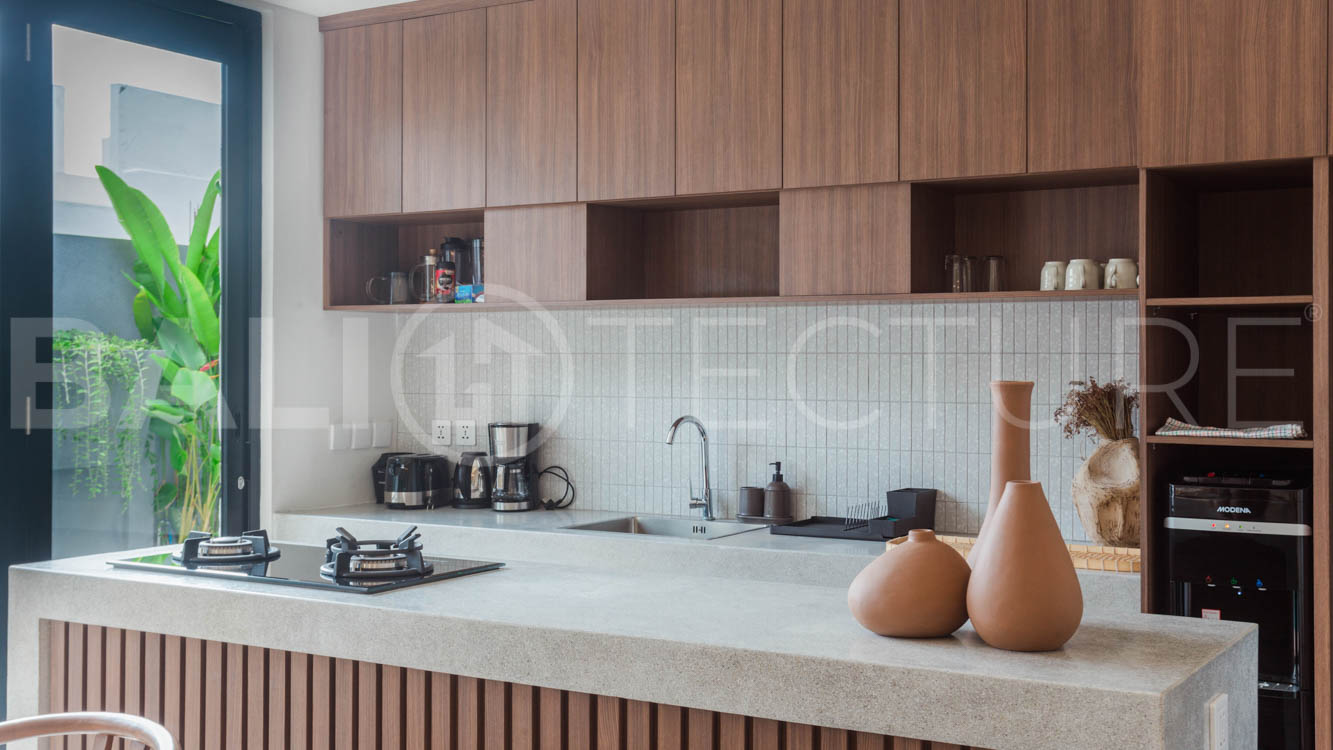 Four-bedroom furnished villa in Padonan, Canggu, featuring three bathrooms, a guest powder room, a private swimming pool, a spacious terrace, a balcony, and flexible indoor-outdoor living spaces, available on a 26-year leasehold.