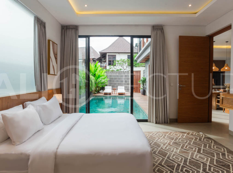Four-bedroom furnished villa in Padonan, Canggu, featuring three bathrooms, a guest powder room, a private swimming pool, a spacious terrace, a balcony, and flexible indoor-outdoor living spaces, available on a 26-year leasehold.