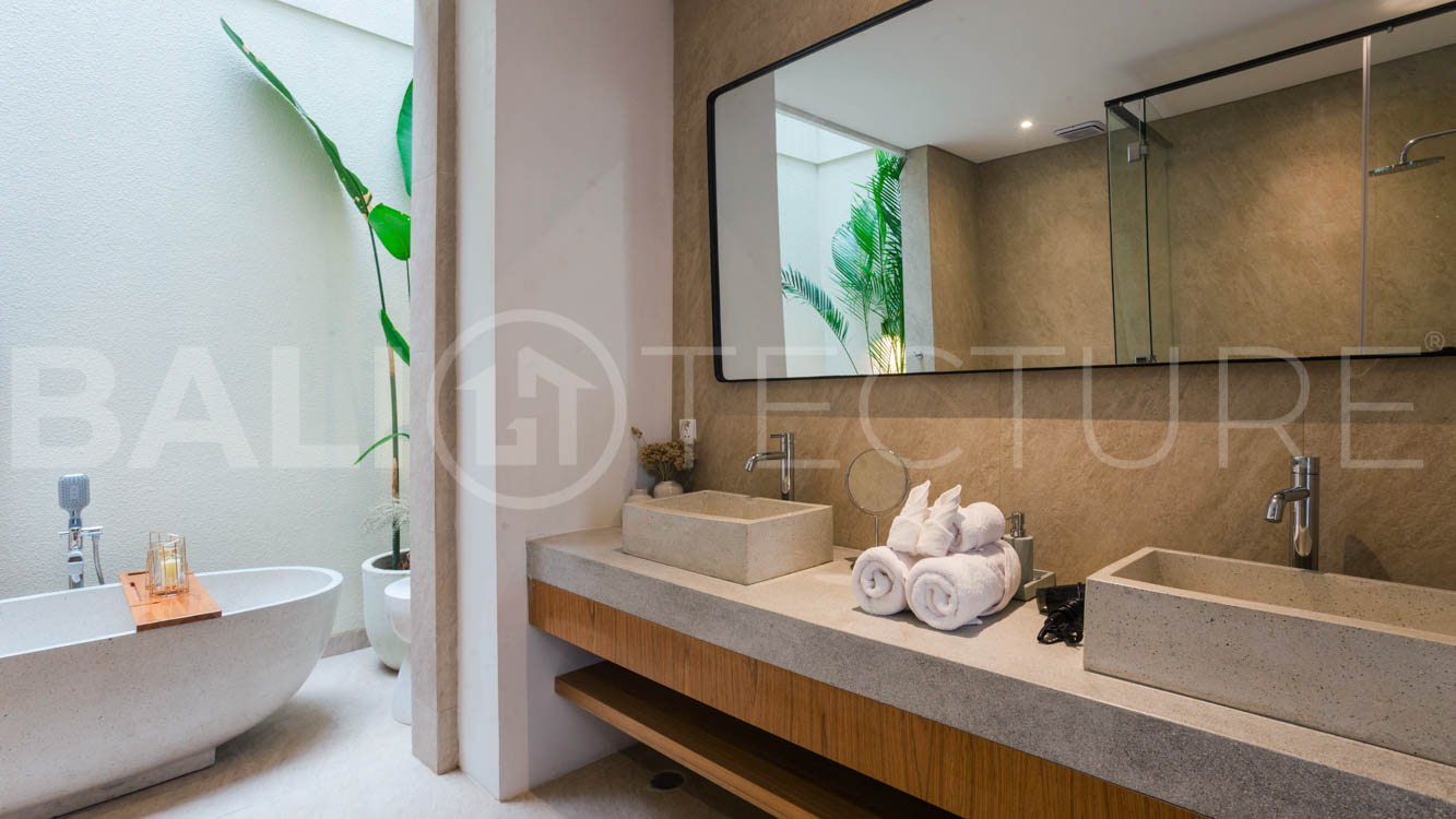 Four-bedroom furnished villa in Padonan, Canggu, featuring three bathrooms, a guest powder room, a private swimming pool, a spacious terrace, a balcony, and flexible indoor-outdoor living spaces, available on a 26-year leasehold.