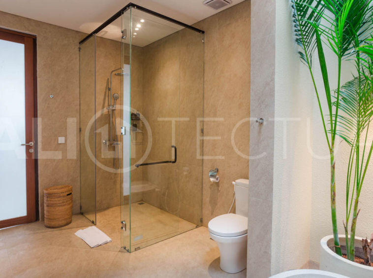 Four-bedroom furnished villa in Padonan, Canggu, featuring three bathrooms, a guest powder room, a private swimming pool, a spacious terrace, a balcony, and flexible indoor-outdoor living spaces, available on a 26-year leasehold.