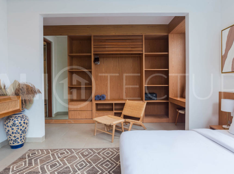 Four-bedroom furnished villa in Padonan, Canggu, featuring three bathrooms, a guest powder room, a private swimming pool, a spacious terrace, a balcony, and flexible indoor-outdoor living spaces, available on a 26-year leasehold.