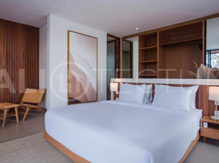 Four-bedroom furnished villa in Padonan, Canggu, featuring three bathrooms, a guest powder room, a private swimming pool, a spacious terrace, a balcony, and flexible indoor-outdoor living spaces, available on a 26-year leasehold.