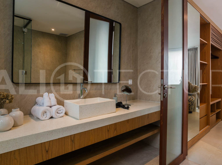 Four-bedroom furnished villa in Padonan, Canggu, featuring three bathrooms, a guest powder room, a private swimming pool, a spacious terrace, a balcony, and flexible indoor-outdoor living spaces, available on a 26-year leasehold.