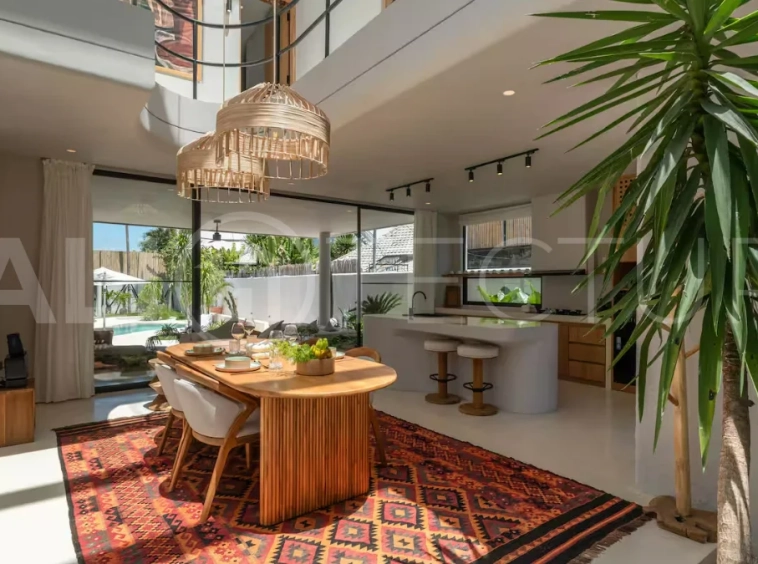 Luxury villa for sale in Canggu, featuring 590.8 m² of land, approximately 200 m² of building space, a lagoon shaped private swimming pool, tropical garden, modern interiors, private sauna, and a leasehold valid until May 2047 with an extension option.